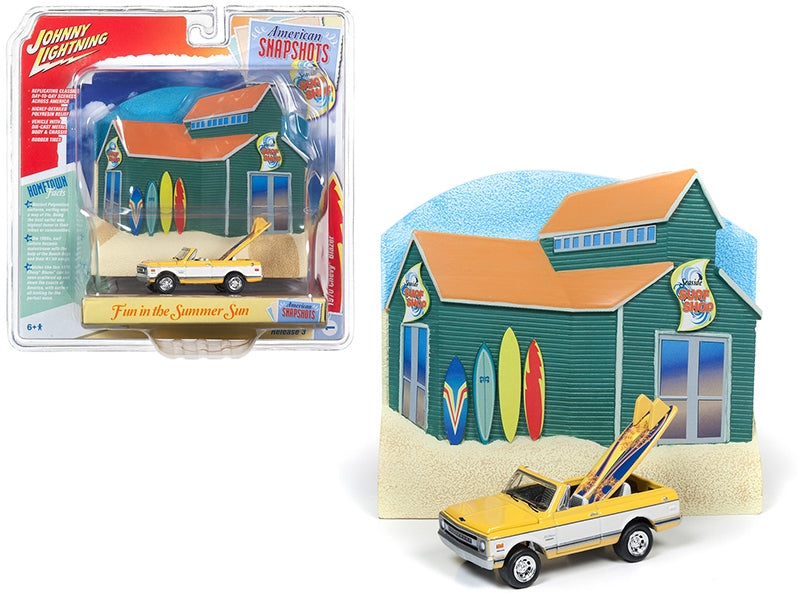 1970 Chevrolet Blazer Convertible Pickup Truck Yellow and White with Surf Boards and "Surf Shop" Front Facade Diorama Set "American Snapshots" 1/64 Diecast Model Car by Johnny Lightning